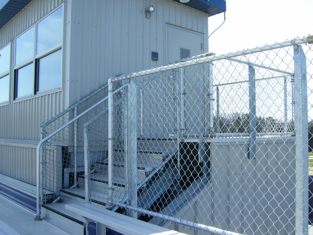 chain-link guardrail, press box, grandstands