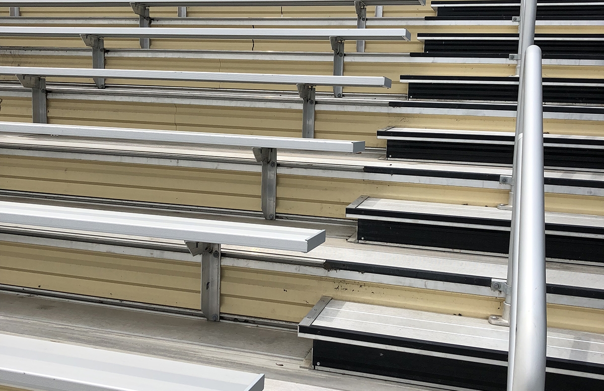 Aluminum bleacher seating featuring stairs with rails