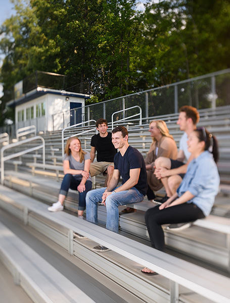 People on grandstands laughing